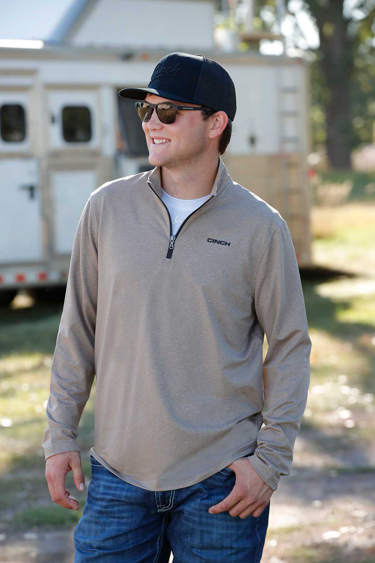 Cinch quarter-zip pullover and trucker hat